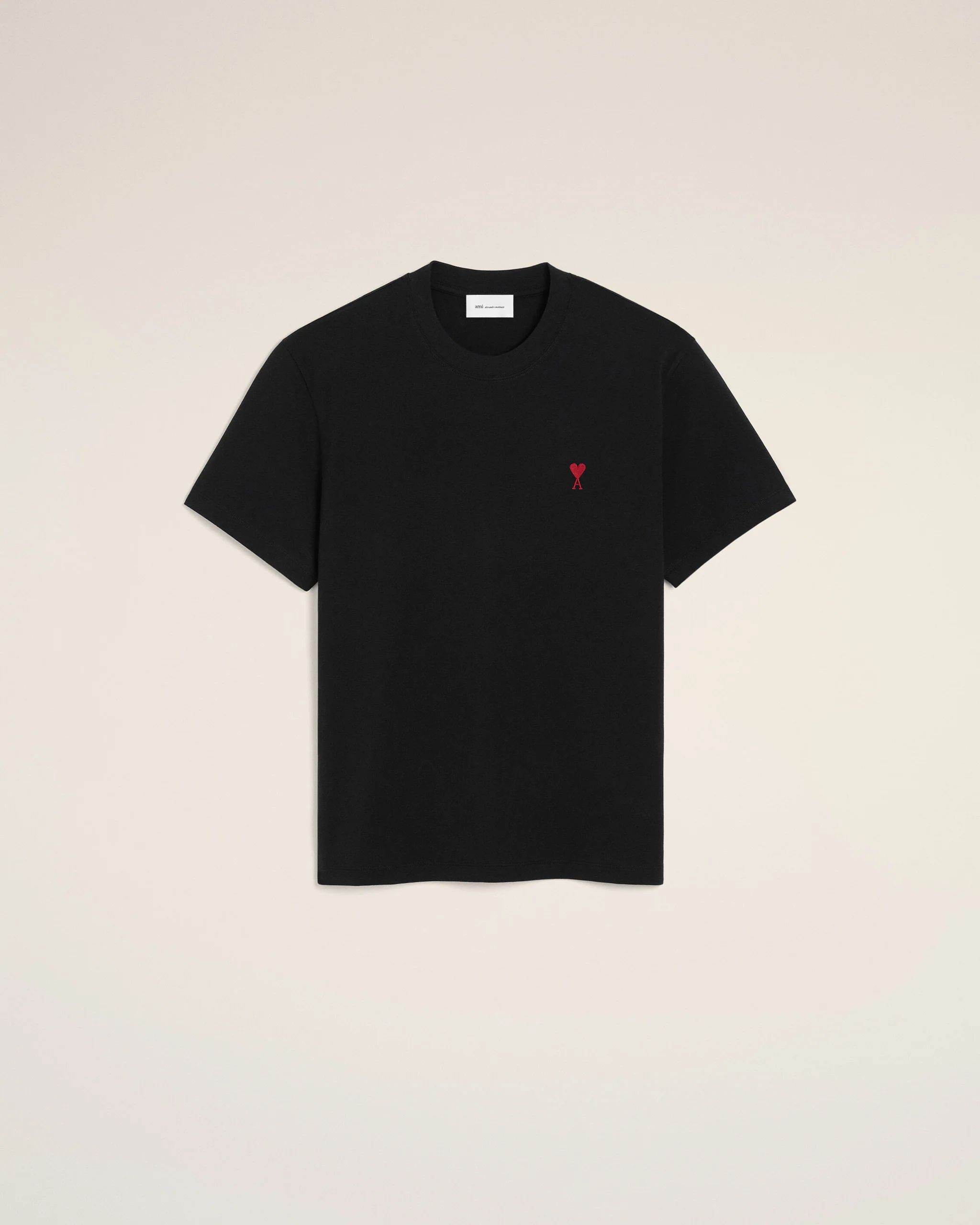 Black short-sleeve T-shirt with a small red heart and an 'A' emblem on the left chest.