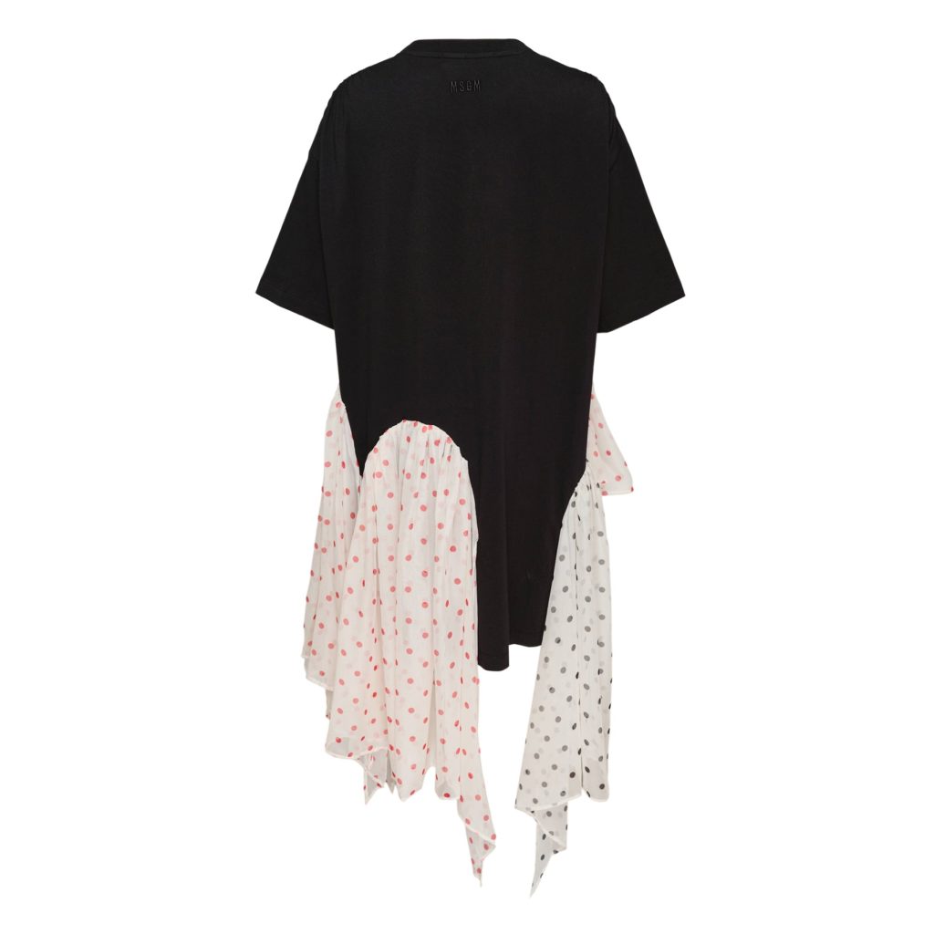 Back view of a black oversized short-sleeve top draped over a white polka‑dot scarf with pink spots.