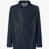 Dark indigo denim jacket with button-front closure, classic collar, and two large patch pockets at the hips l up.