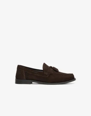 Brown suede tassel loafer shown in a side profile with a black sole and visible stitching