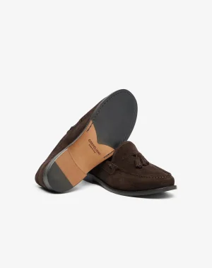 Brown suede tassel loafer with a dark gray toe cap, shown at an angled side view.