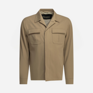 Beige utility jacket with two flap chest pockets and a concealed front closure, brand tag inside collar.