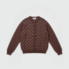 Brown knit cardigan with pearl-like beads scattered across the front and dark buttons down the center.