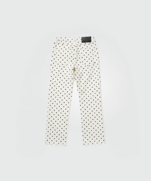 Back view of white polka-dot pants with two rear pockets and a dark label on the waistband.