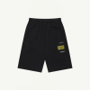 Black athletic shorts with an elastic waistband and side pockets, featuring small patches on the right leg