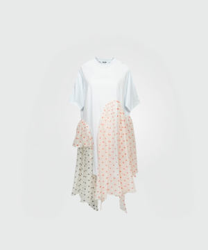 Loose white dress with airy light-blue short sleeves and patchwork polka-dot panels in pink and gray creating an asymmetric hem