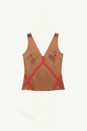 Brown satin sleeveless V-neck top with red crisscross straps across the back.