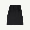Black skirt viewed from the waist down, featuring an elastic waistband and smooth drape.