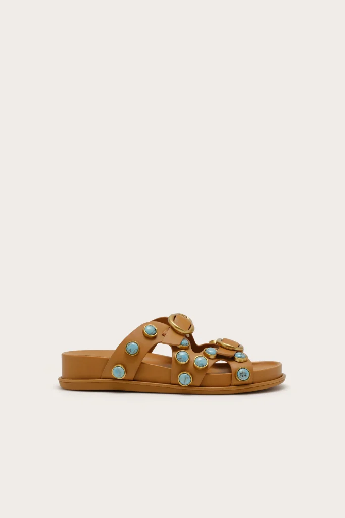 Tan leather slide sandal with turquoise stone accents along the straps.