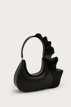 Black leather handbag with a large circular handle and sculpted wavy top edge.