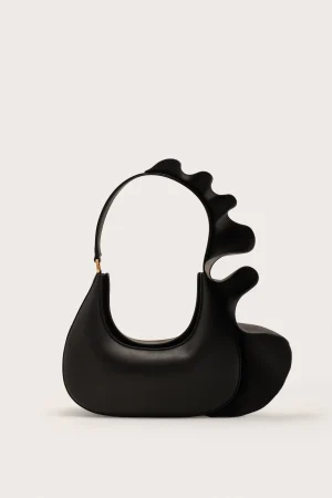 Black handbag with a circular opening and a wavy, sculpted strap detail on the right side against a light background