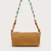 Tan suede shoulder bag with a turquoise-stone accented strap and knotted leather ends by Cult Gaia.