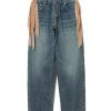 Wide-leg blue denim jeans with tan fabric ribbons tied at the belt loops, casual fashion styling.