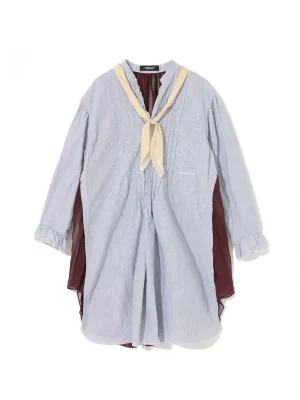 Oversized light blue striped tunic with a cream tie-neck scarf; burgundy lining shows at the sleeves/leaves