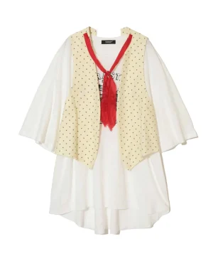 Cream oversized blouse layered with a beige star-pattern vest and a red neck scarf tie.