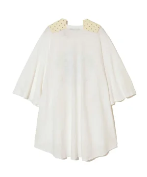White cape-style dress with pale yellow collar patches adorned with small stars