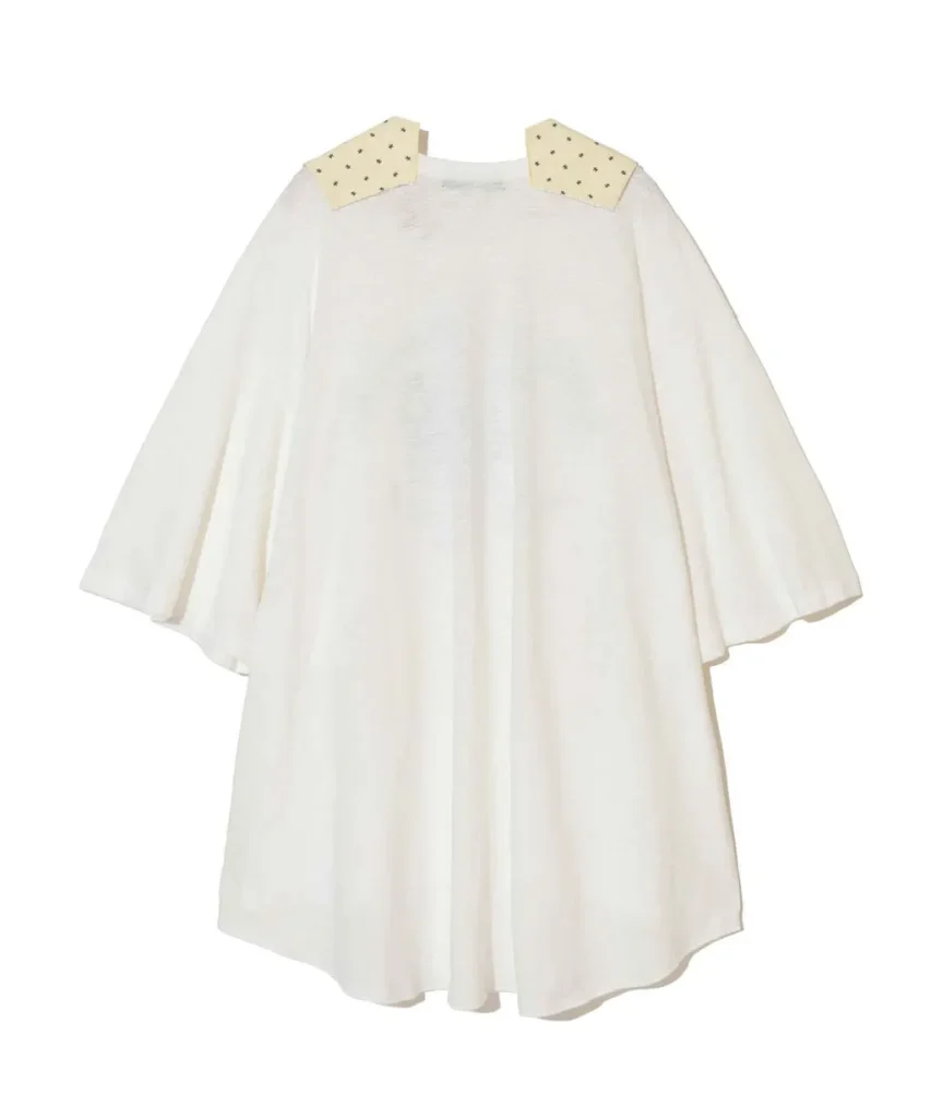 White cape-style dress with pale yellow collar patches adorned with small stars