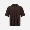 Brown short-sleeve button-down shirt with a left chest pocket, displayed on a plain background
