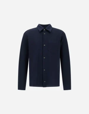 Navy blue long-sleeve button-down shirt with a front chest pocket on a white background.