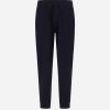 Front view of navy elastic-waist pants with a relaxed fit and tapered legs.