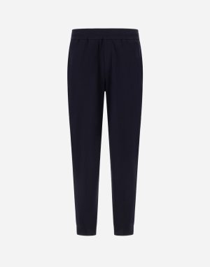 Front view of navy elastic-waist pants with a relaxed fit and tapered legs.