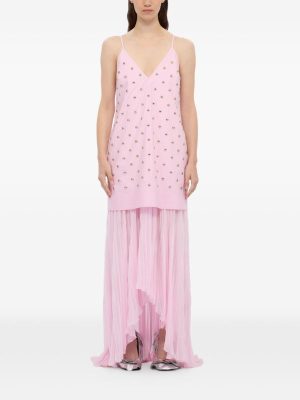 Pink spaghetti-strap slip dress with bead embellishments over a long sheer pink pleated overlay, worn by a model.