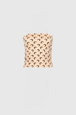 Beige upholstered chair with a repeating black crescent moon pattern.