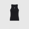 Front view of a black sleeveless athletic tank top with a small white circular logo on the chest area.