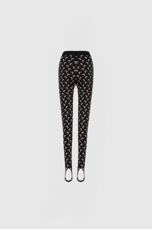 Waist-to-toe view of a mannequin wearing black leggings with a cream crescent pattern on a light gray background.