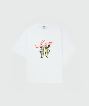 White oversized T-shirt featuring a red MSGM script logo and a yellow-and-black scarf graphic on the front.