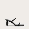 Black open-toe sandal with a thin strap and a beaded high heel.