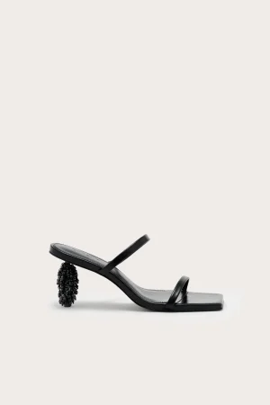 Black open-toe sandal with a thin strap and a beaded high heel.