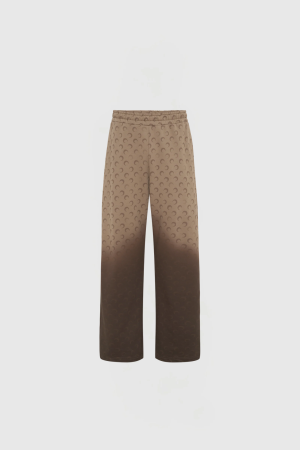 Beige trousers with a repeating brown crescent pattern shown from the waist to the lower legs against a light background.