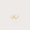Gold ring with two pale blue bezel-set stones, large oval and small teardrop shapes, on a light background.