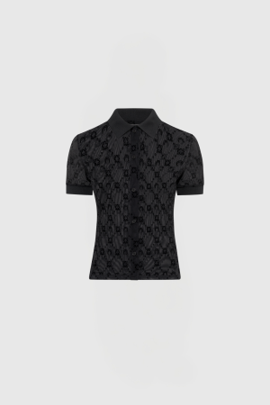Black short-sleeve button-up blouse with a pointed collar and subtle floral lace pattern, shown from the waist up on a gray background