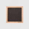 Peach square frame with a black patterned panel of repeating crescent motifs; "MARINE SERRE" logo at bottom-right.