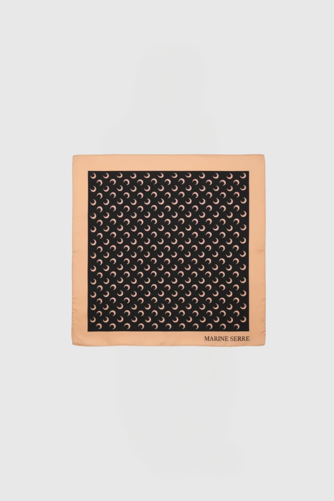 Peach square frame with a black patterned panel of repeating crescent motifs; "MARINE SERRE" logo at bottom-right.