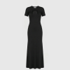Black floor-length dress with short sleeves and a large circular cutout at the chest on a black silhouette