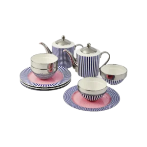 Blue and white striped porcelain tea set with pink accents, including two teapots, two teacups, and matching saucers on a white surface.